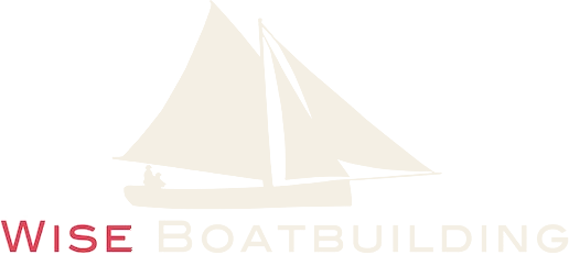 Wise Boatbuilding logo, a traditional sailboat mark
