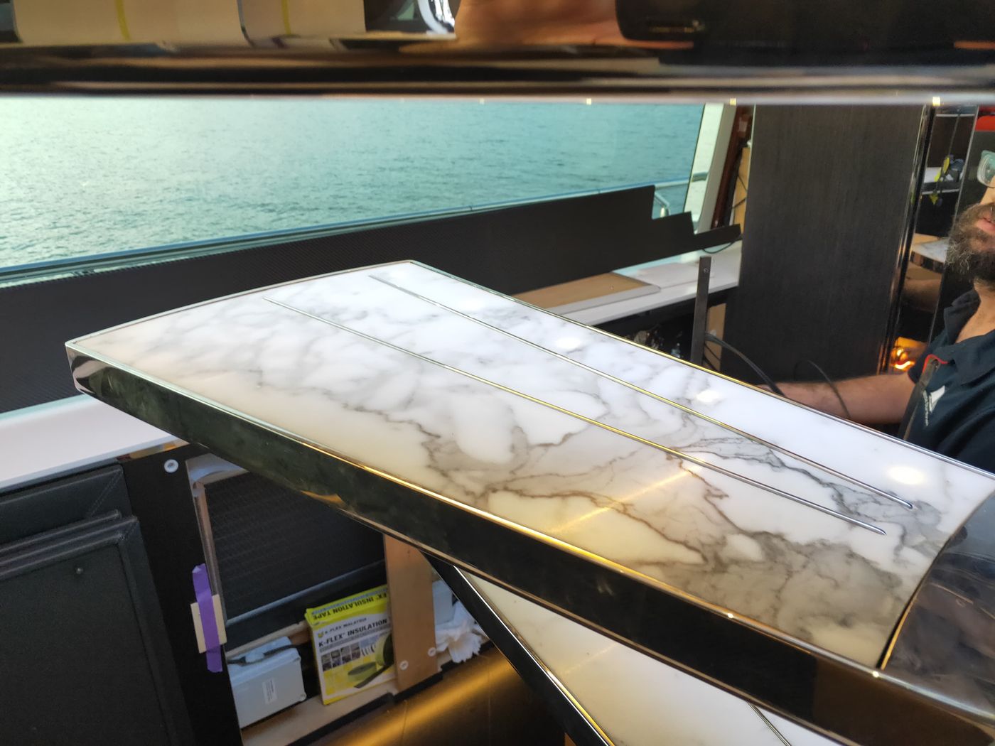 Marble benchtop being fitted on board during an interior refit