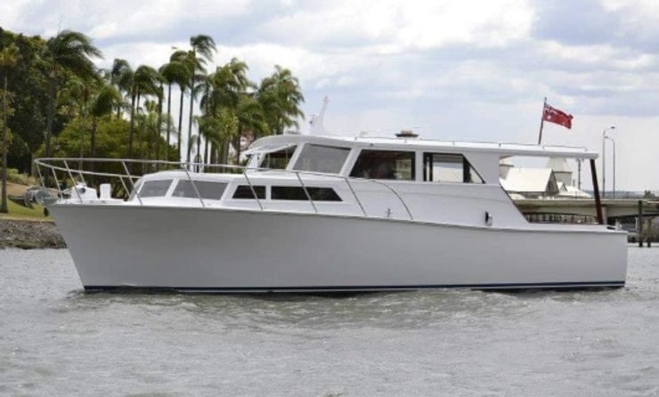 Restored timber cruiser on the water after restoration